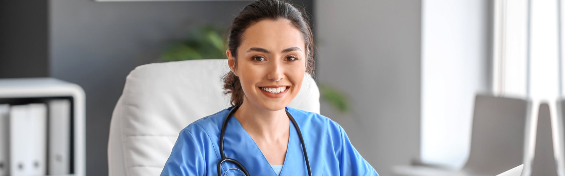 nurse smiling and sitting